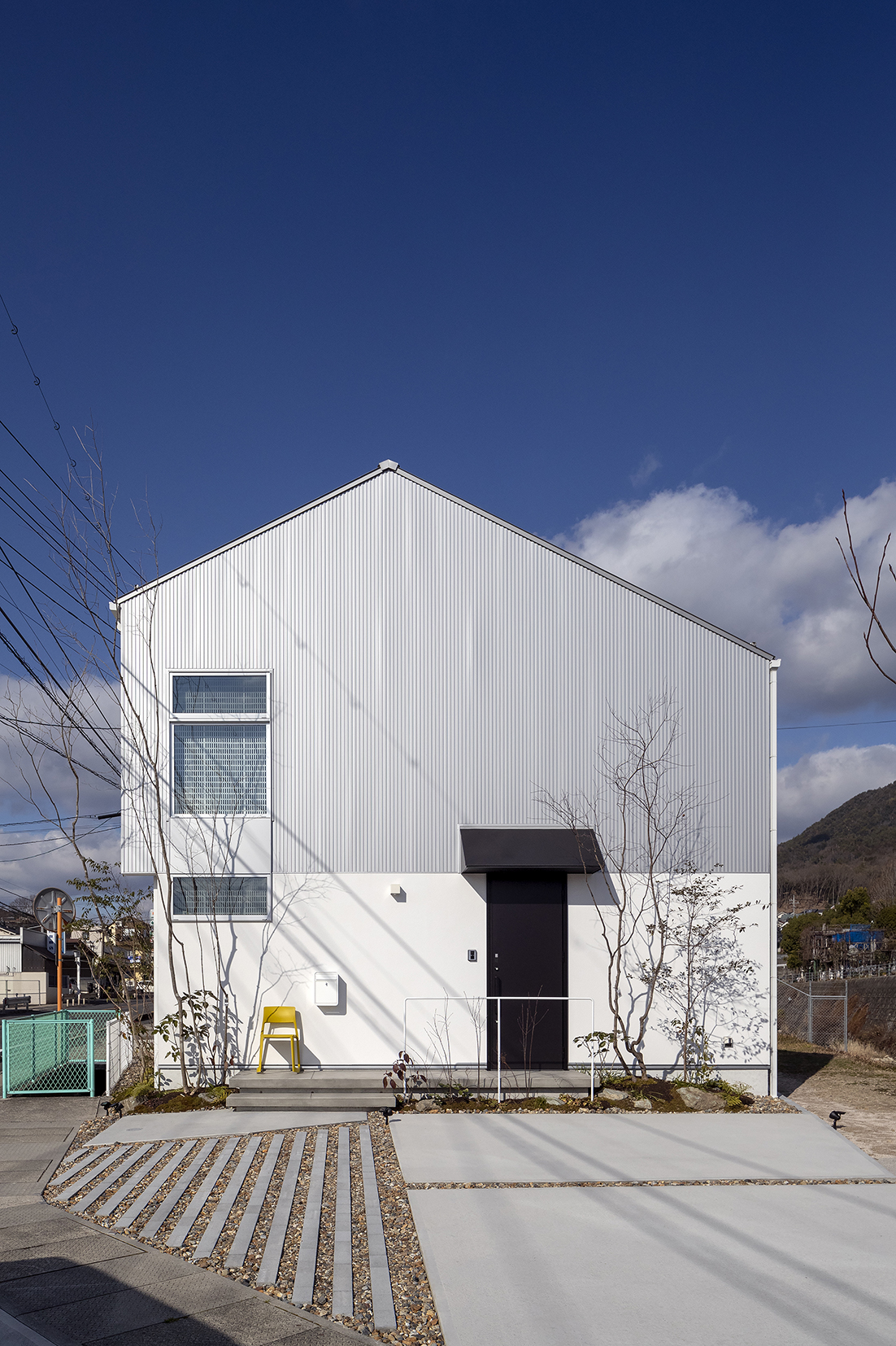 素材に寄り添う家